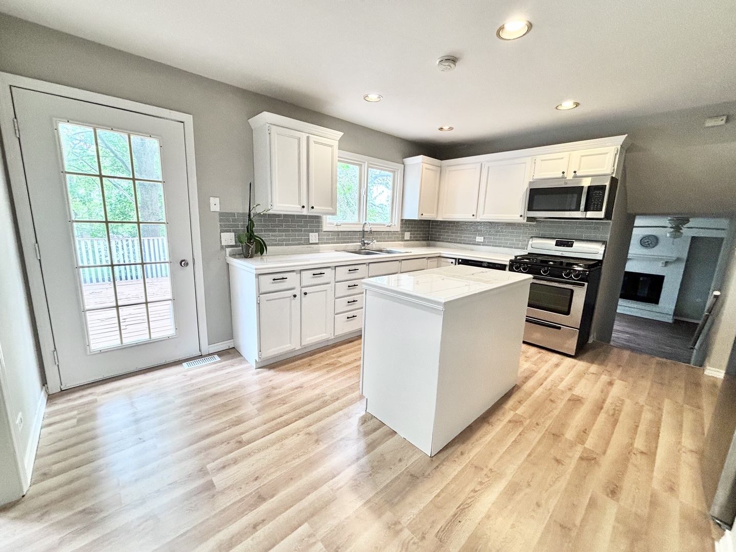 615 North Blanchard Street Wheaton, IL 60187 - Photo 3 of 19 a kitchen with stainless steel appliances granite countertop a stove top oven a sink dishwasher and a refrigerator