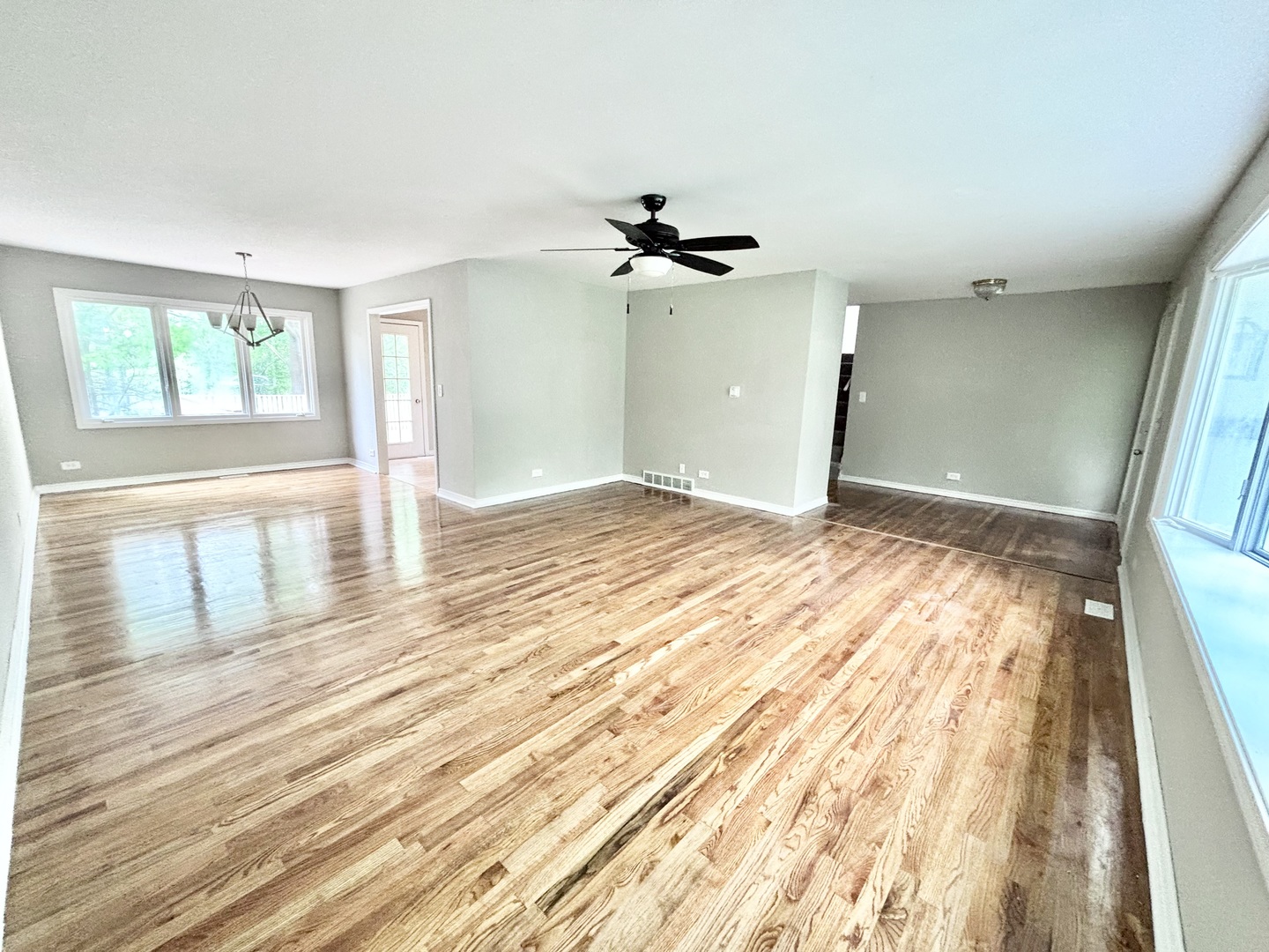 615 North Blanchard Street Wheaton, IL 60187 - Photo 5 of 19 a view of empty room with wooden floor and fan