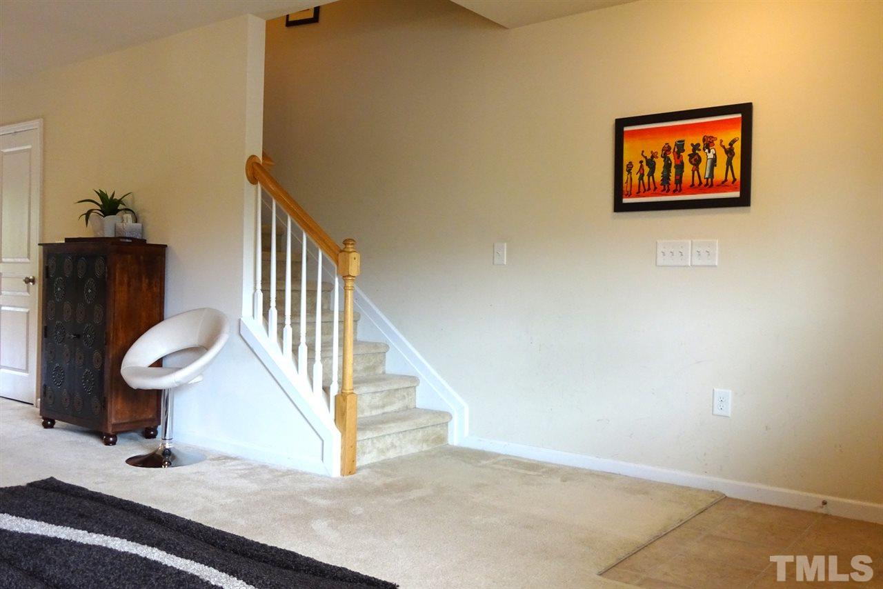 2938 Berkeley Springs Place Raleigh, NC 27616 - Photo 12 of 19 a view of a hallway with staircase