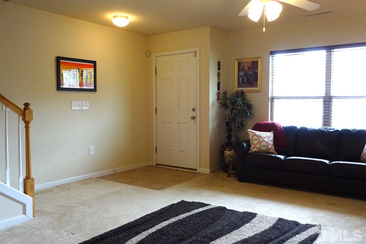 2938 Berkeley Springs Place Raleigh, NC 27616 - Photo 4 of 19 a living room with furniture and a window