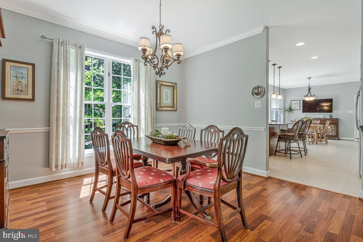 11565 Magnolia Court Issue, MD 20645 - Photo 26 of 68 a view of a dining room with furniture wooden floor and chandelier
