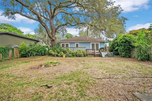 a front view of a house with a yard and a garage