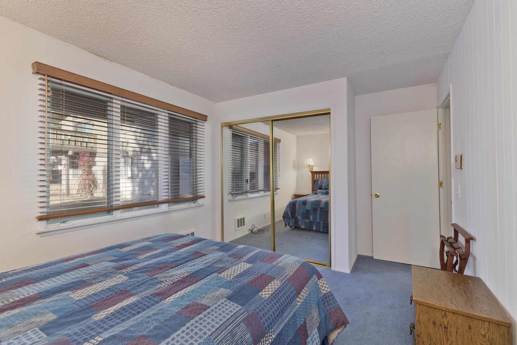 3251-40 Chateau Road, Unit 40 Mammoth Lakes, CA 93546 - Photo 12 of 31 a bedroom with a bed and a large window