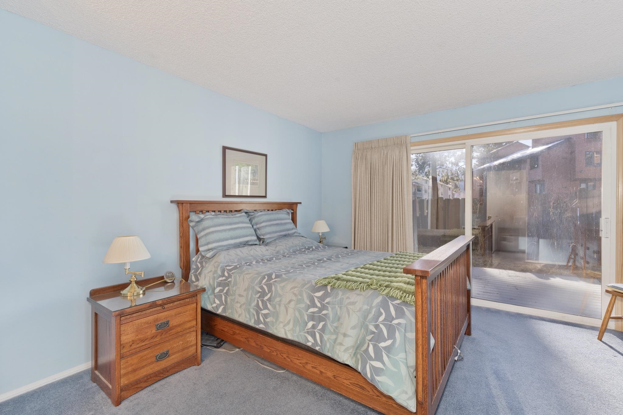 3251-40 Chateau Road, Unit 40 Mammoth Lakes, CA 93546 - Photo 14 of 31 a bedroom with a bed and glass door