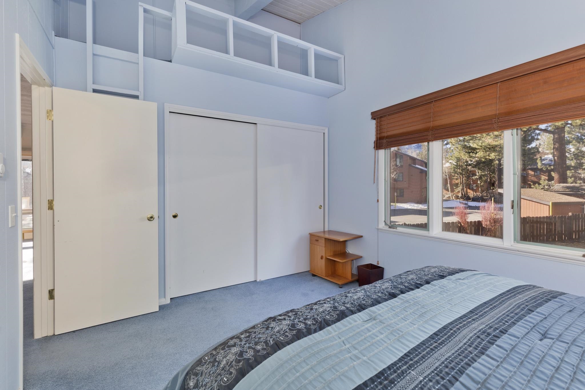 3251-40 Chateau Road, Unit 40 Mammoth Lakes, CA 93546 - Photo 19 of 31 a bedroom with a bed and a large window