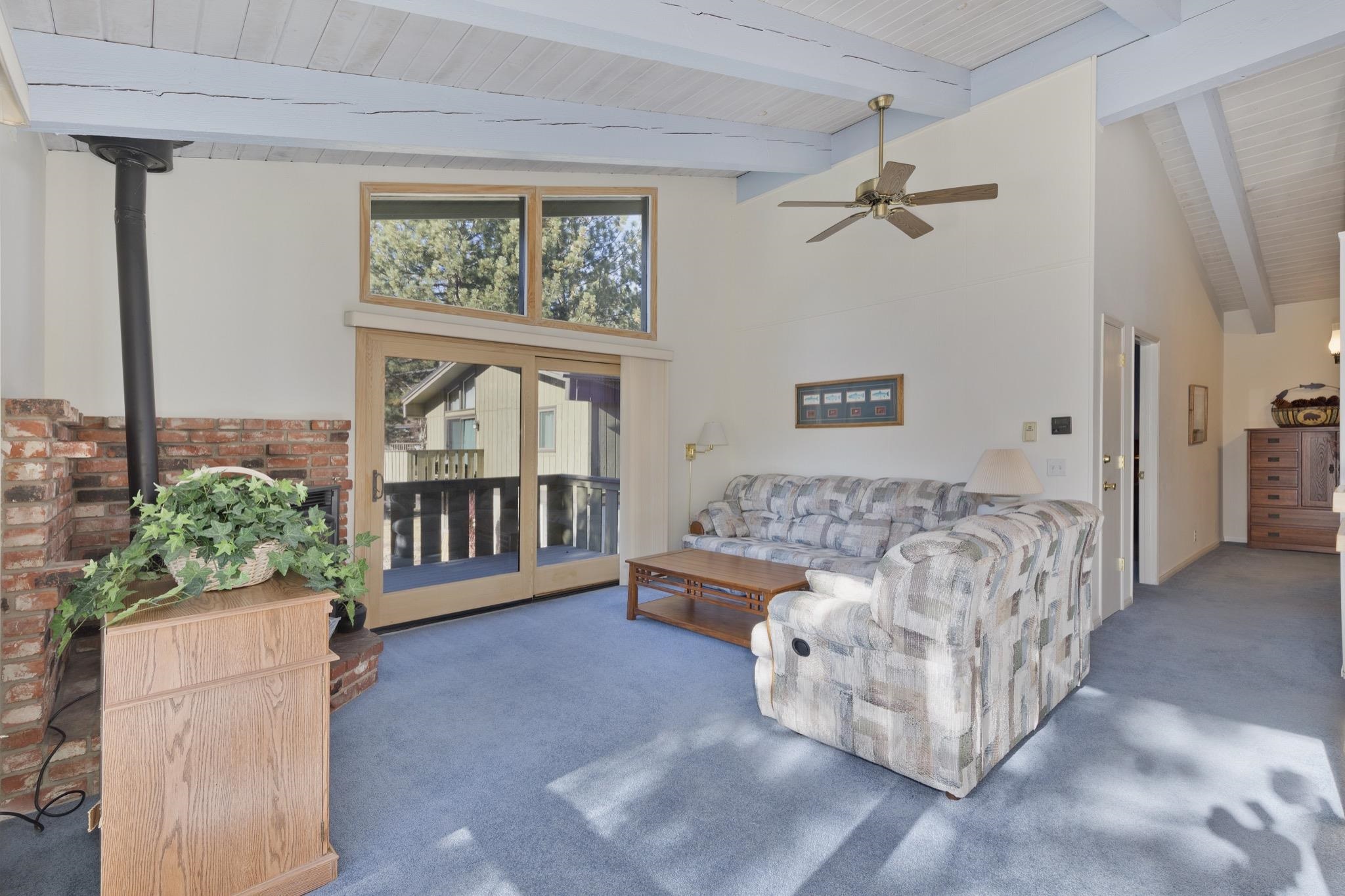 3251-40 Chateau Road, Unit 40 Mammoth Lakes, CA 93546 - Photo 2 of 31 a living room with furniture and a large window
