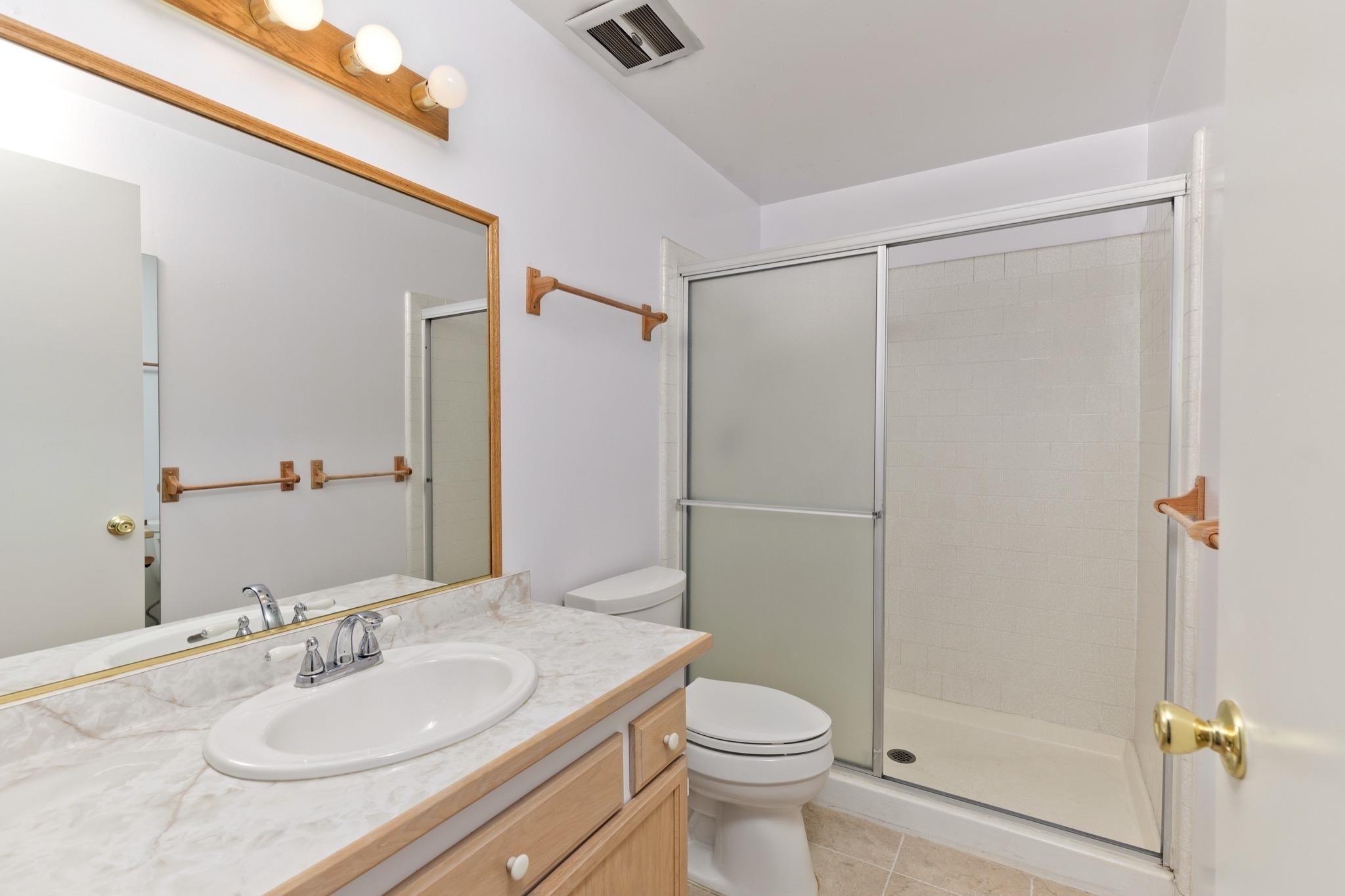 3251-40 Chateau Road, Unit 40 Mammoth Lakes, CA 93546 - Photo 21 of 31 a bathroom with a granite countertop sink toilet and shower