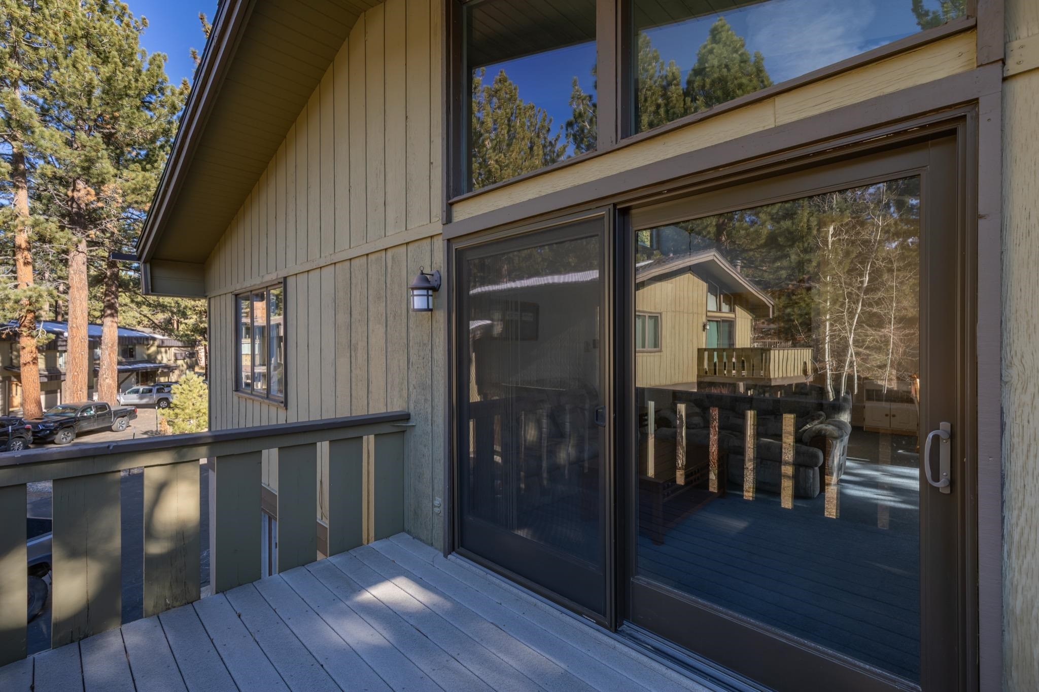 3251-40 Chateau Road, Unit 40 Mammoth Lakes, CA 93546 - Photo 23 of 31 a view of a balcony with chairs and wooden floor