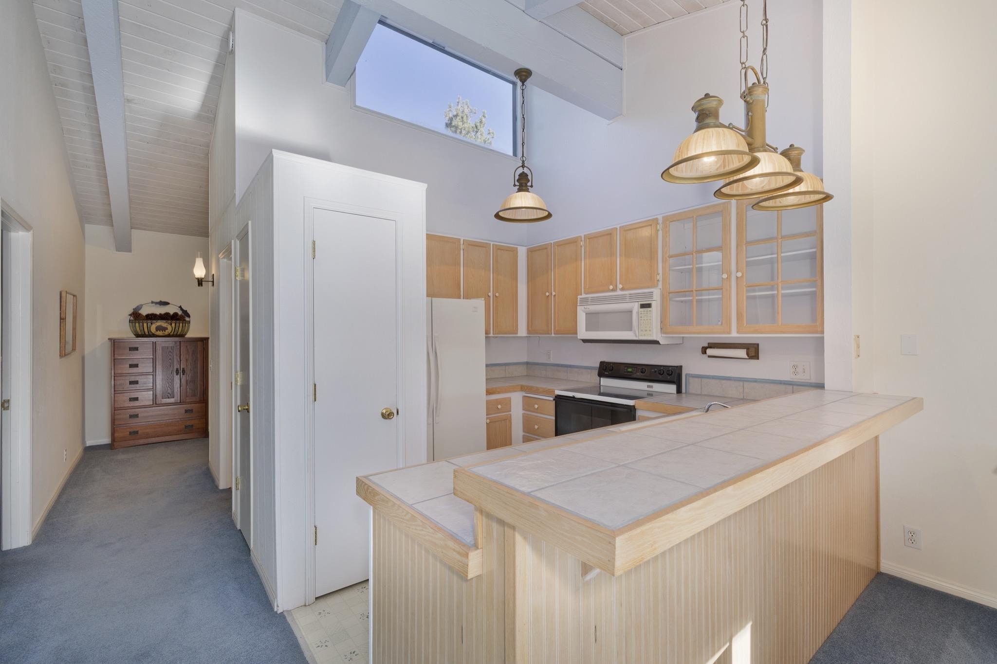 3251-40 Chateau Road, Unit 40 Mammoth Lakes, CA 93546 - Photo 5 of 31 a kitchen with stainless steel appliances granite countertop a sink and a refrigerator