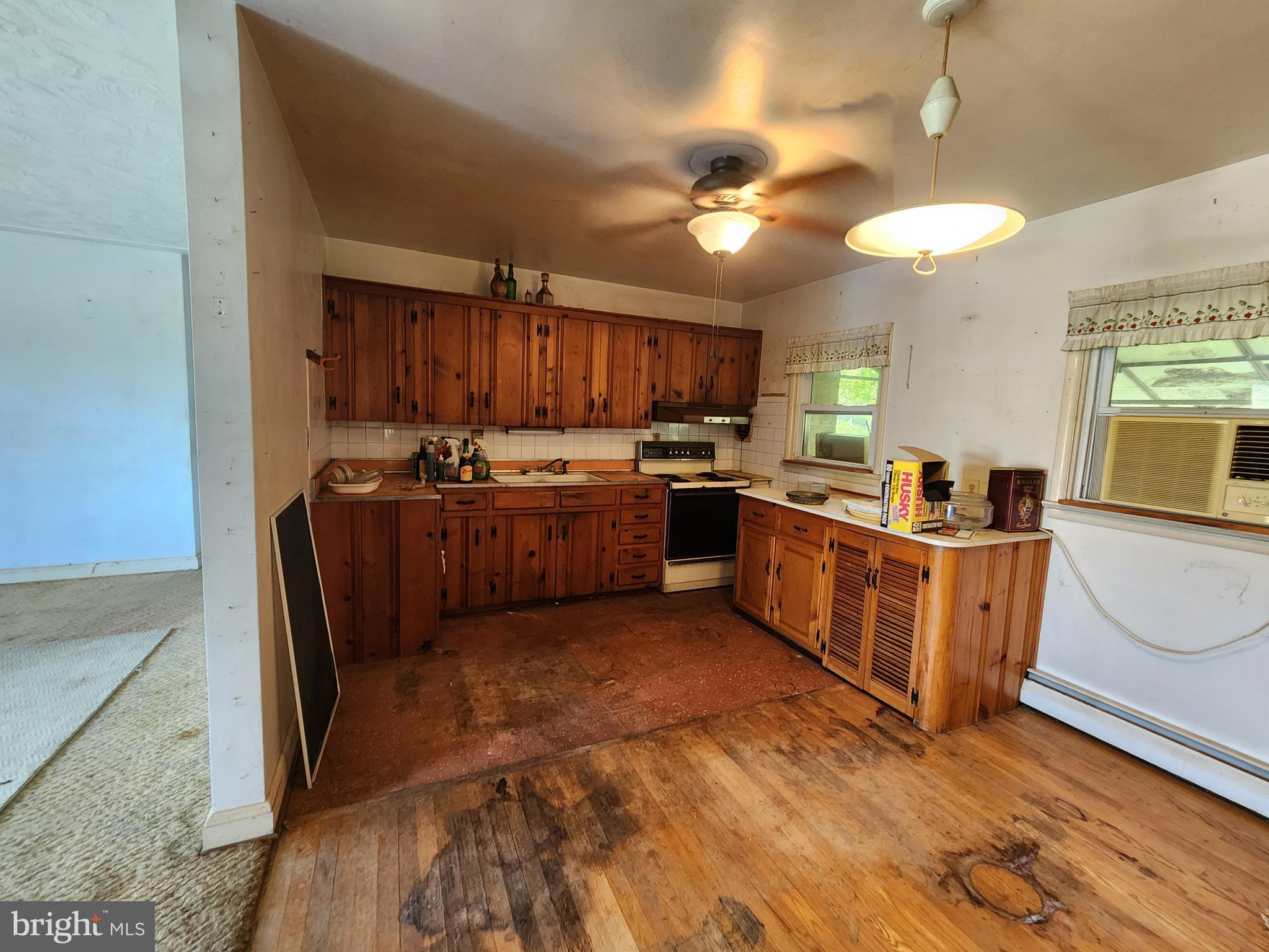 404 West Pearl Street Rising Sun, MD 21911 - Photo 4 of 7 a large kitchen with stainless steel appliances granite countertop a stove sink and cabinets