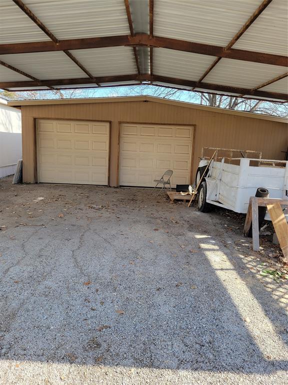145 Lakeview Road Roanoke, TX 76262 - Photo 4 of 6 Secure Room for lots of stuff and a 2 vehicle covered parking