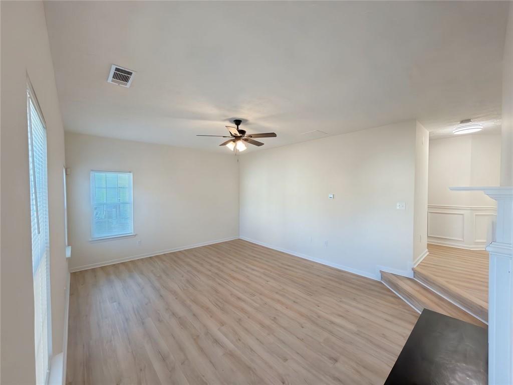 2770 Austin Ridge Drive Northeast Dacula, GA 30019 - Photo 12 of 51 a view of empty room with wooden floor and fan