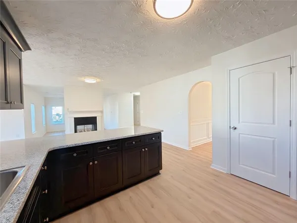 a spacious bathroom with a double vanity sink and a mirror