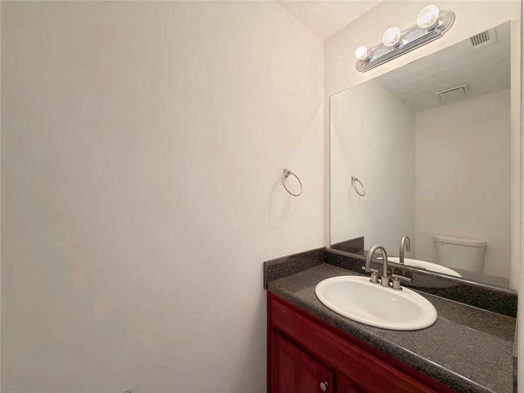 2770 Austin Ridge Drive Northeast Dacula, GA 30019 - Photo 25 of 51 a bathroom with a sink and a mirror