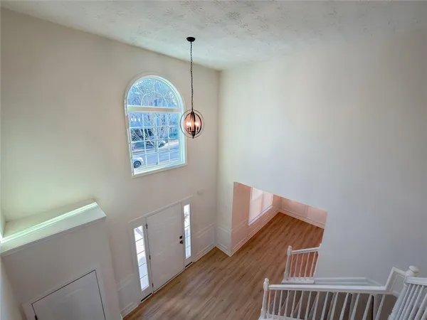 a view of a hallway with stairs