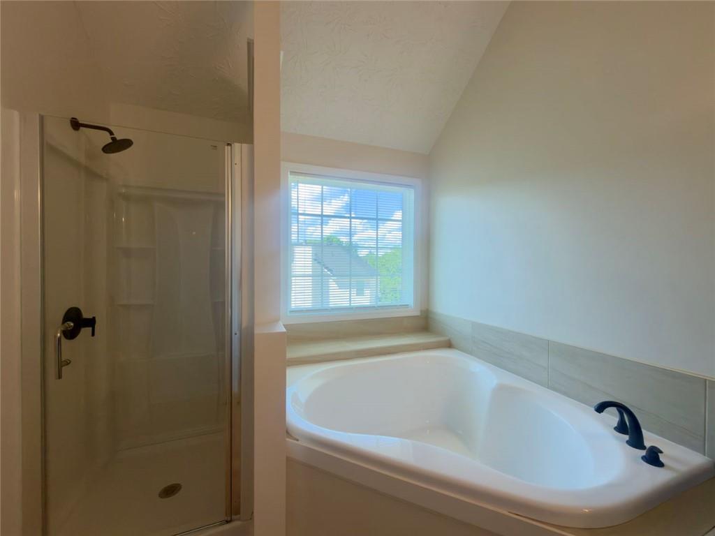 2770 Austin Ridge Drive Northeast Dacula, GA 30019 - Photo 38 of 51 a white bath tub sitting next to a window