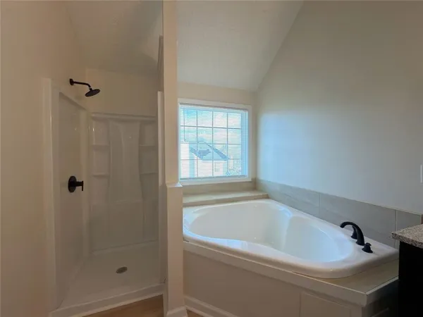 a white bath tub sitting next to a window