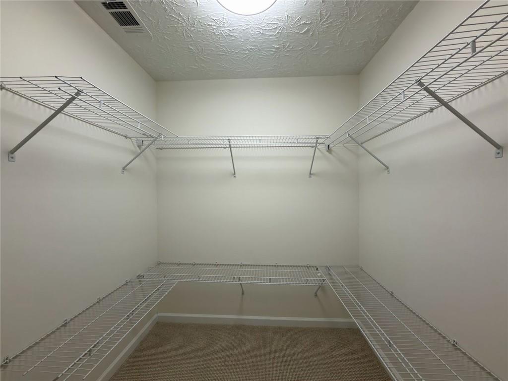 2770 Austin Ridge Drive Northeast Dacula, GA 30019 - Photo 42 of 51 a view of a room with racks on the wall