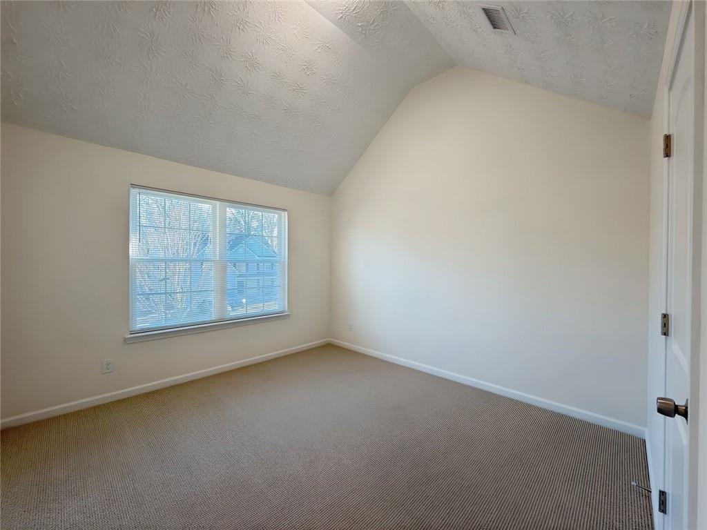 2770 Austin Ridge Drive Northeast Dacula, GA 30019 - Photo 45 of 51 an empty room with a window