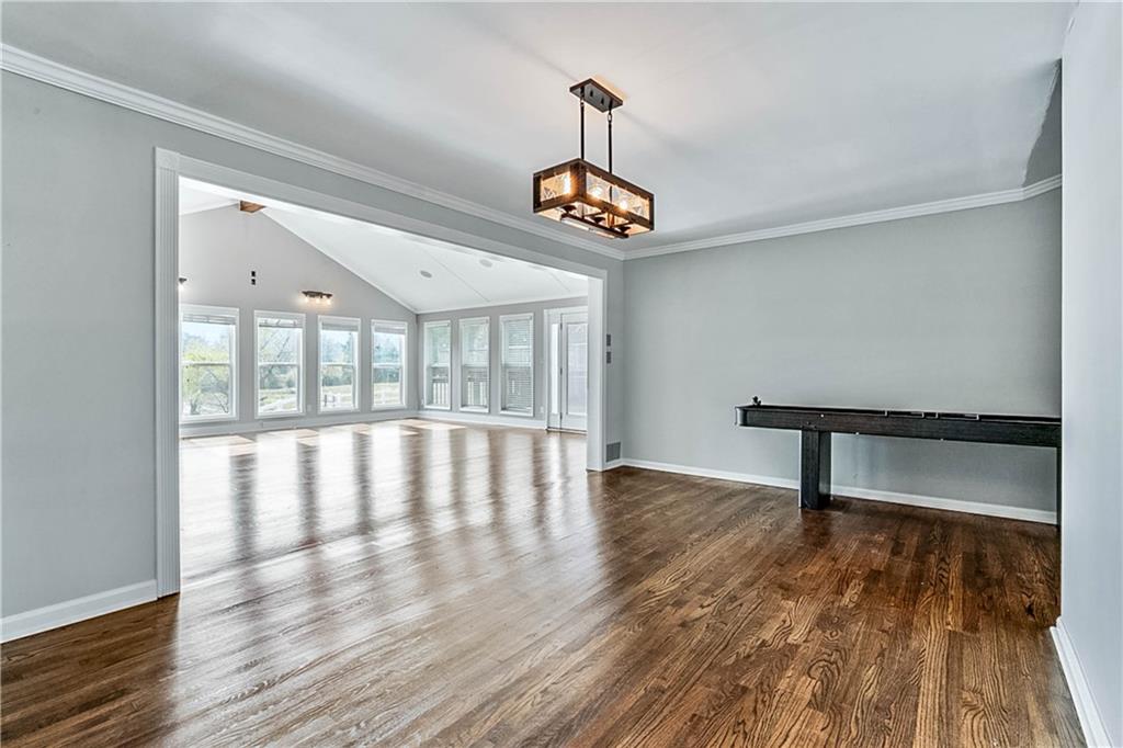 2670 Old Jackson Road Locust Grove, GA 30248 - Photo 13 of 30 a view of empty room with wooden floor and fan