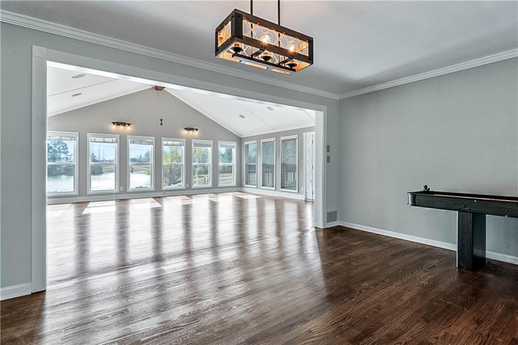 2670 Old Jackson Road Locust Grove, GA 30248 - Photo 14 of 30 a view of an empty room with wooden floor and a window