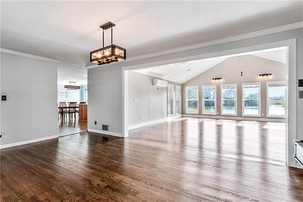 2670 Old Jackson Road Locust Grove, GA 30248 - Photo 15 of 30 a view of empty room with wooden floor and windows