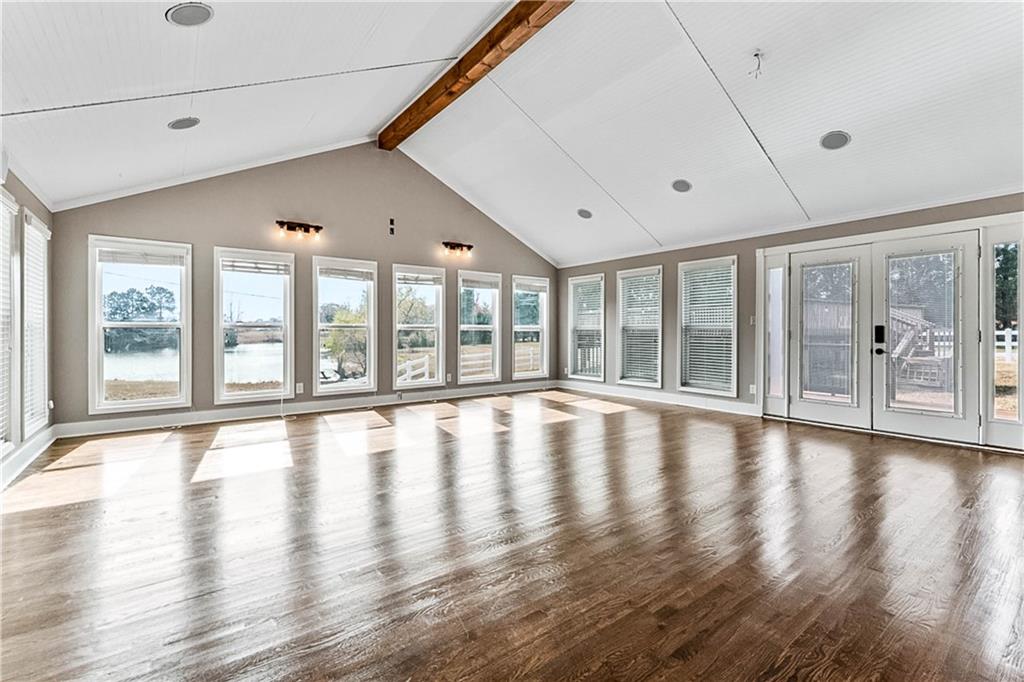 2670 Old Jackson Road Locust Grove, GA 30248 - Photo 16 of 30 a view of an empty room with wooden floor and a window
