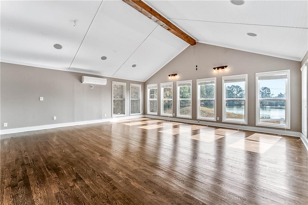 2670 Old Jackson Road Locust Grove, GA 30248 - Photo 17 of 30 a view of an empty room with wooden floor and a window