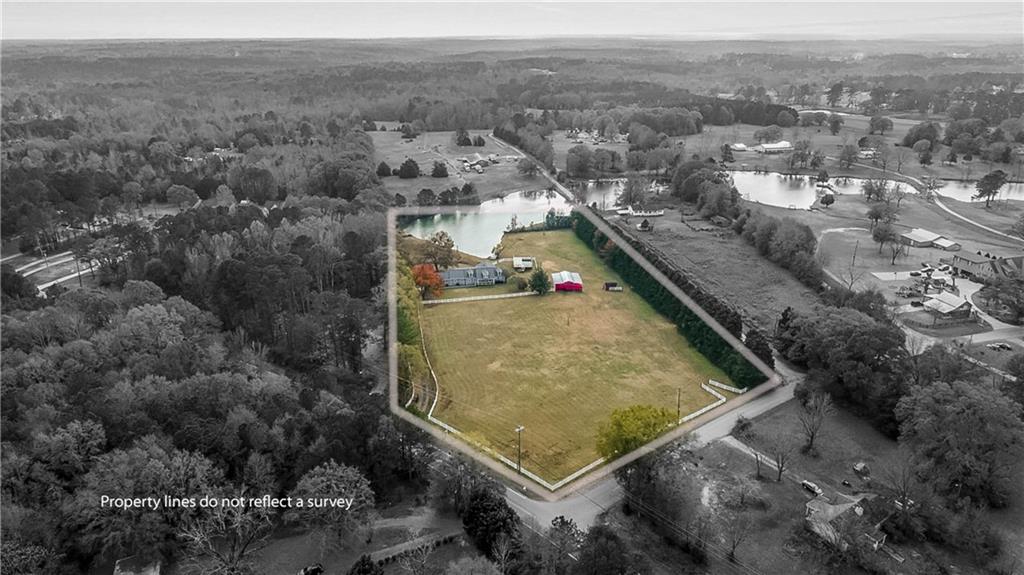 2670 Old Jackson Road Locust Grove, GA 30248 - Photo 2 of 30 an aerial view of residential houses with outdoor space