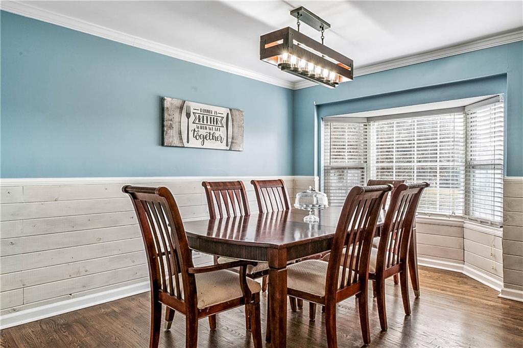 2670 Old Jackson Road Locust Grove, GA 30248 - Photo 22 of 30 a view of a dining room with furniture wooden floor and chandelier