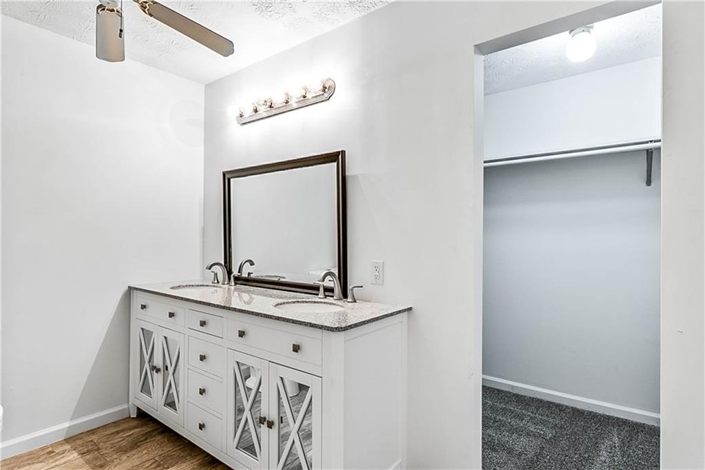 2670 Old Jackson Road Locust Grove, GA 30248 - Photo 25 of 30 a bathroom with a sink and a mirror