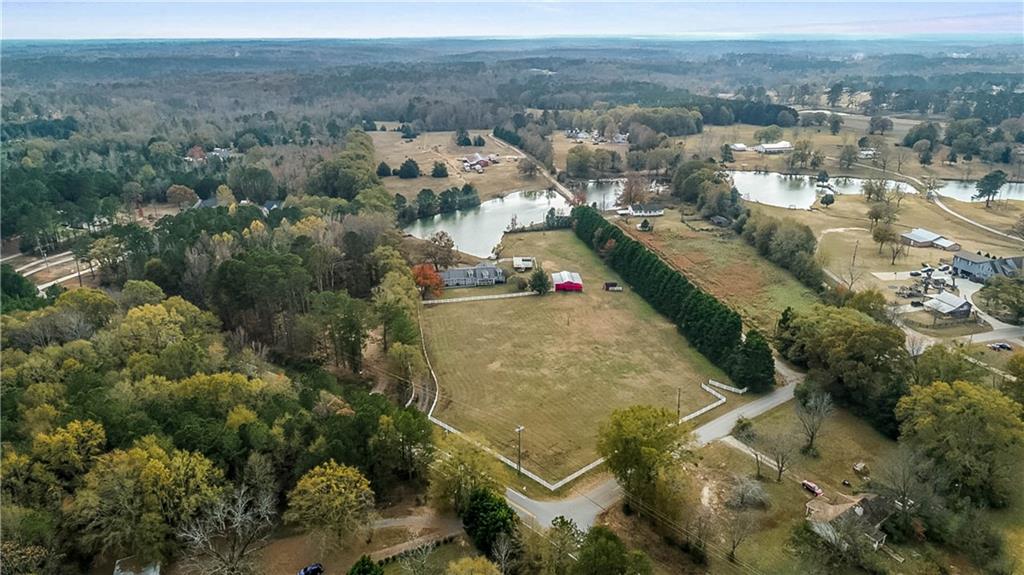2670 Old Jackson Road Locust Grove, GA 30248 - Photo 3 of 30 an aerial view of residential houses with outdoor space