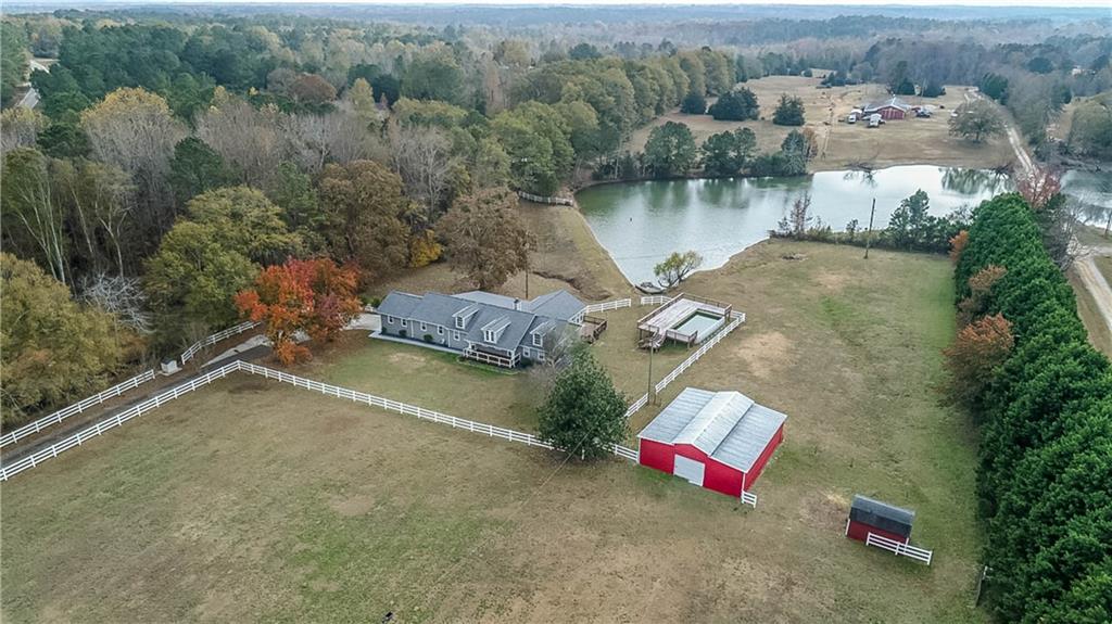 2670 Old Jackson Road Locust Grove, GA 30248 - Photo 5 of 30 an aerial view of a house with outdoor space and lake view