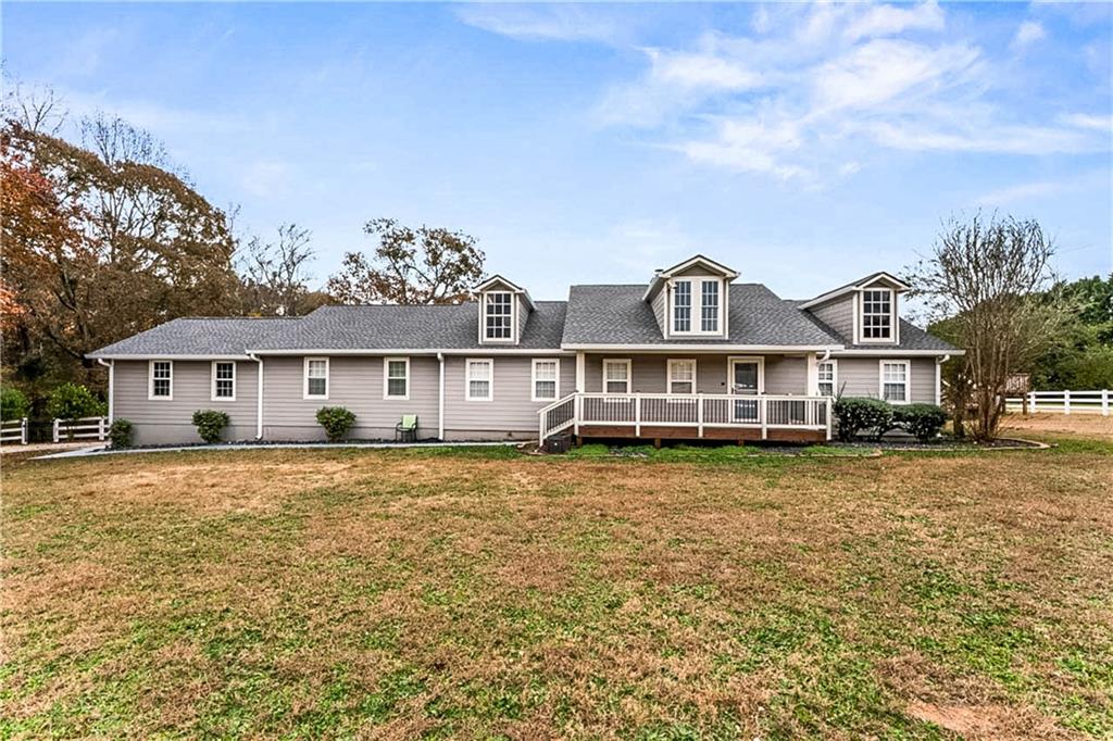 2670 Old Jackson Road Locust Grove, GA 30248 - Photo 6 of 30 a front view of a house with a garden and yard