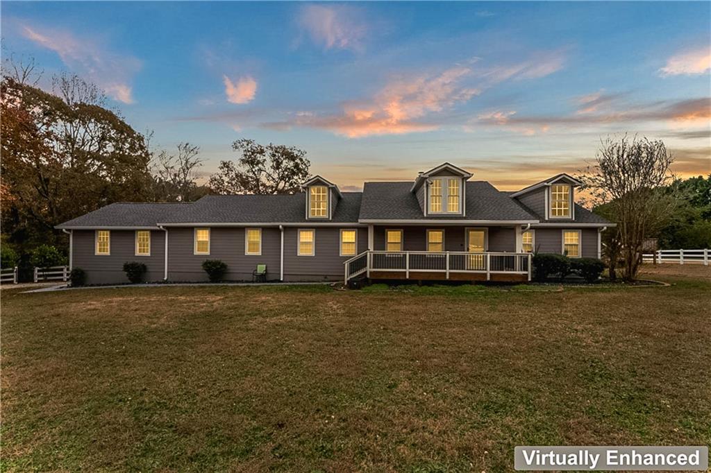 2670 Old Jackson Road Locust Grove, GA 30248 - Photo 7 of 30 a view of a big house with a big yard and large trees