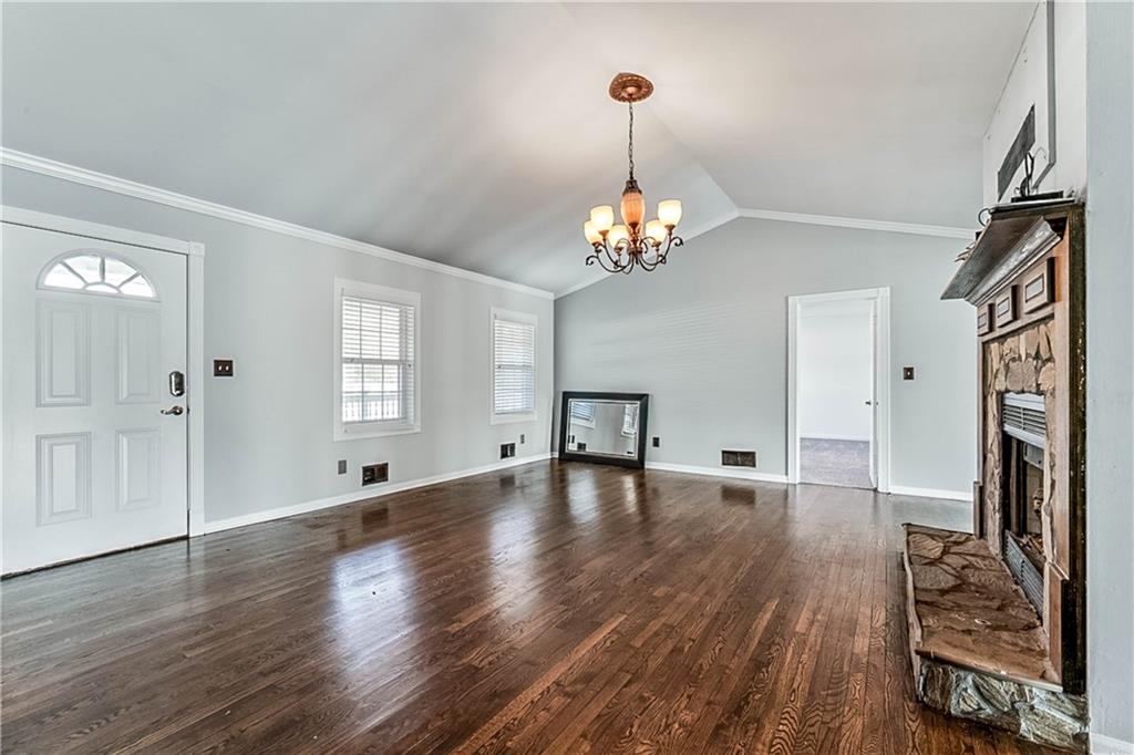 2670 Old Jackson Road Locust Grove, GA 30248 - Photo 10 of 30 a view of empty room with wooden floor and window