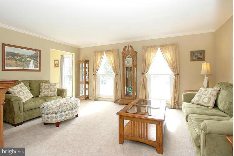 1840 Middlebridge Drive Silver Spring, MD 20906 - Photo 2 of 25 a living room with furniture and a large window