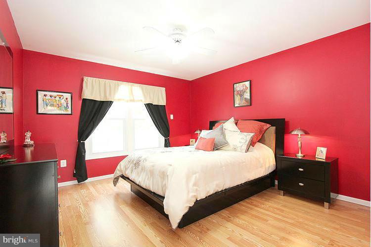 1840 Middlebridge Drive Silver Spring, MD 20906 - Photo 12 of 25 a bedroom with a bed and a night stand