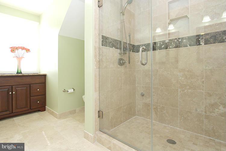1840 Middlebridge Drive Silver Spring, MD 20906 - Photo 18 of 25 a bathroom with a shower and a sink