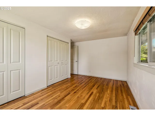 a bathroom with a sink toilet a mirror and shower