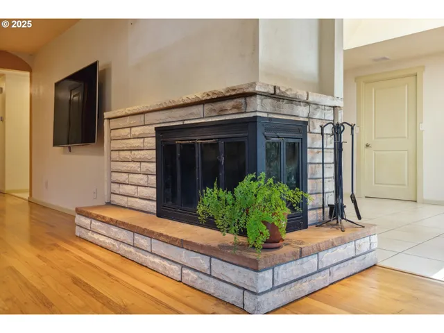 a living room with lots of furniture and kitchen view