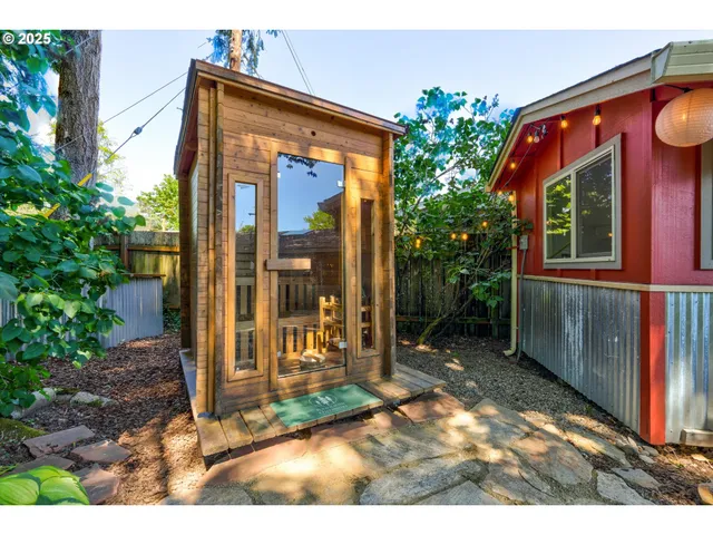 a view of a backyard with potted plants
