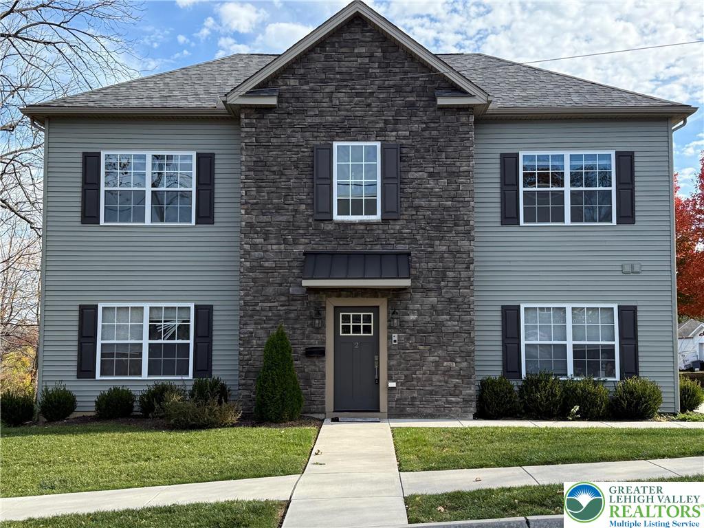 1332 Genoa Street, Unit 2 Bethlehem, PA 18018 - Photo 1 of 12 a front view of a house with garden