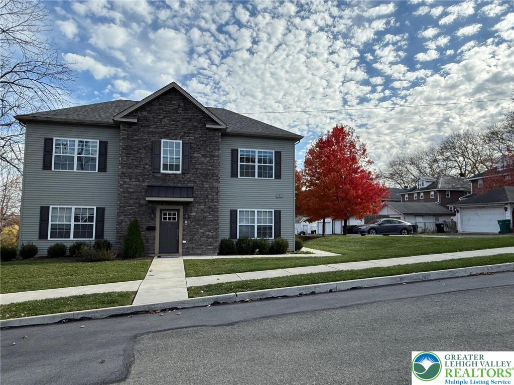 1332 Genoa Street, Unit 2 Bethlehem, PA 18018 - Photo 2 of 12 a front view of a house with a yard
