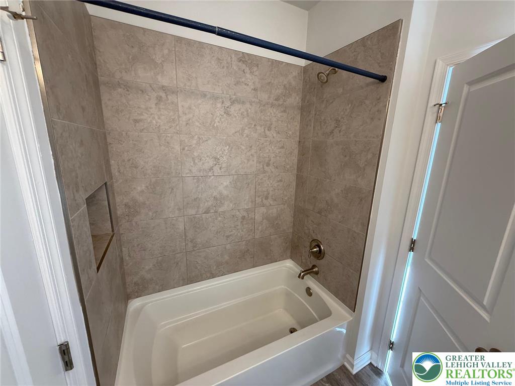 1332 Genoa Street, Unit 2 Bethlehem, PA 18018 - Photo 6 of 12 a bathroom with a bathtub and a shower