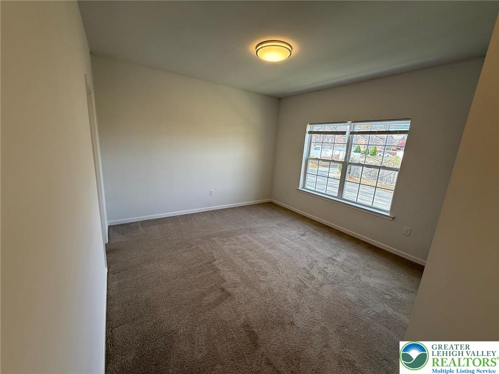 1332 Genoa Street, Unit 2 Bethlehem, PA 18018 - Photo 9 of 12 an empty room with windows