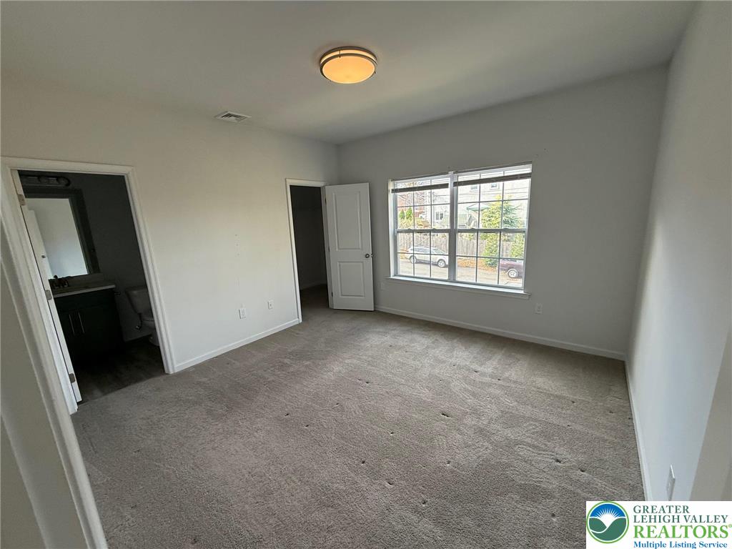 1332 Genoa Street, Unit 2 Bethlehem, PA 18018 - Photo 10 of 12 an empty room with windows