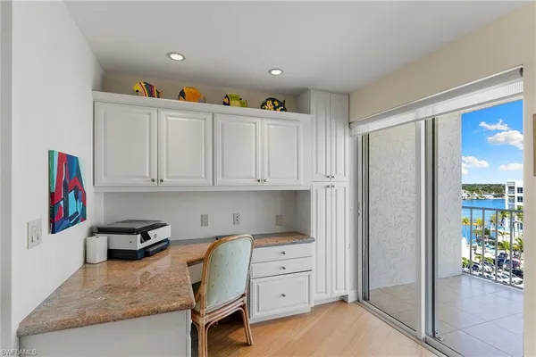 a kitchen with cabinets a stove and a refrigerator