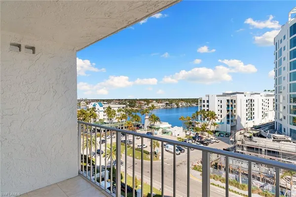 a view of a balcony with chairs