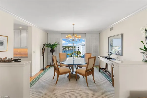 a view of a dining room with furniture window and outside view